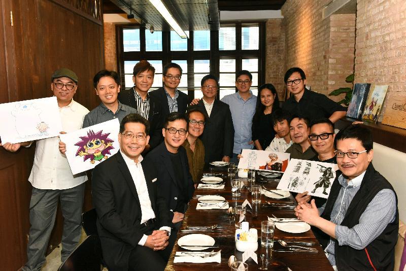 Mr So (front row, first left) is pictured with the comic artists.