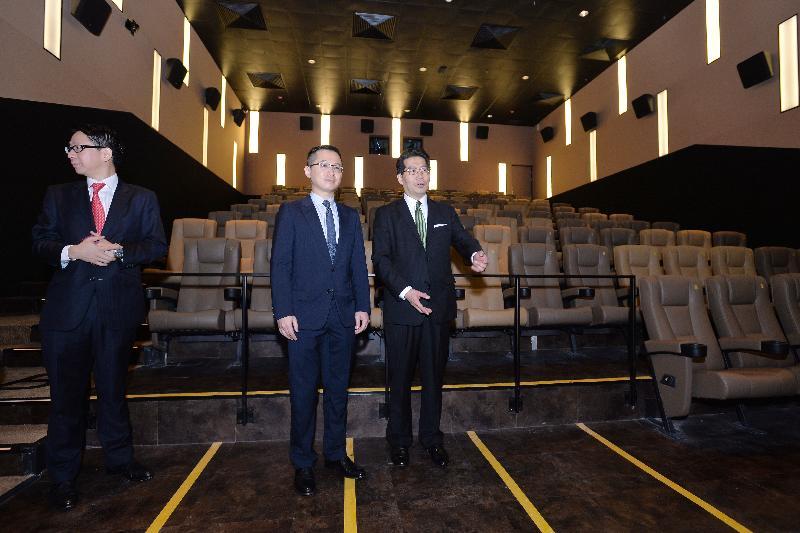 Mr Gregory So (first right) is shown the wheelchair spaces for persons with disabilities.