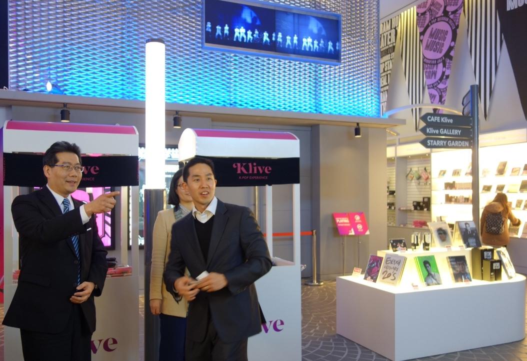 Mr So (left) visits Klive, a dedicated K-pop hologram performance hall.